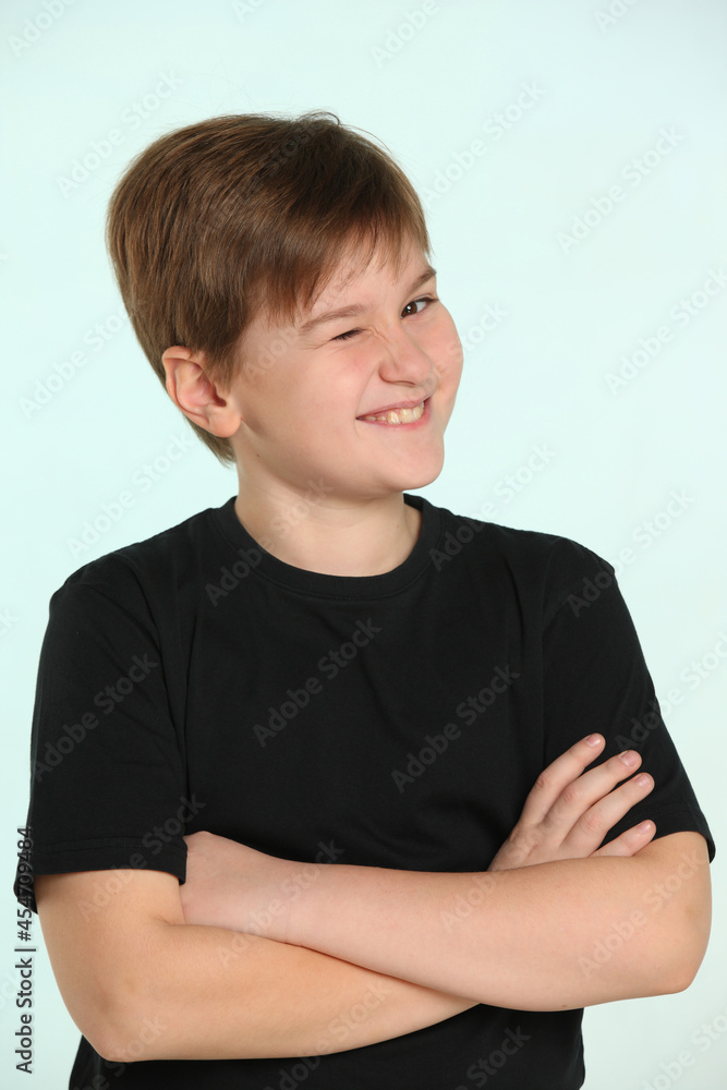 In the portrait, a smart and talented child prodigy winks cheerfully. In the portrait, a smart and talented child prodigy winks cheerfully.