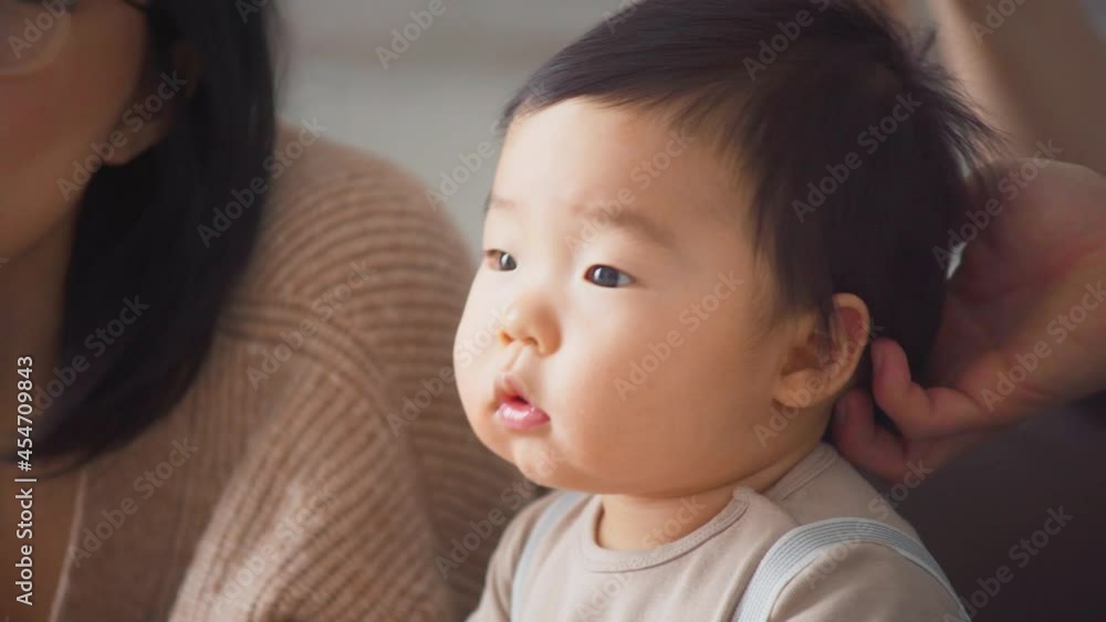 Happy Asian Family Mother and Cute Little Boy Son Having Fun Enjoying Sweet Moments Together. Mom Kissing Baby on Cheek. Young Parents With Baby Kid. Happy Childhood. Parents Love and Care. Happy Asian Family Mother and Cute Little Boy Son Having Fun Enjoying Sweet Moments Together. Mom Kissing Baby on Cheek. Young Parents With Baby Kid. Happy Childhood. Parents Love and Care.