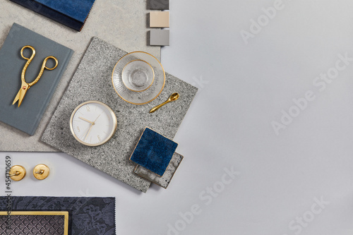 Flat lay of creative architect moodboard composition with samples of building, textile and natural materials and personal accessories. Top view, white background, template.