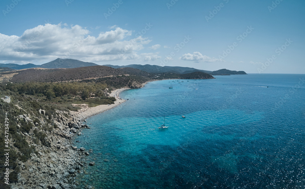 Aerial view of turquoise sea in the little bay in the south of Sardinia (CALA REGINA and Mari Pintau) travel destination.