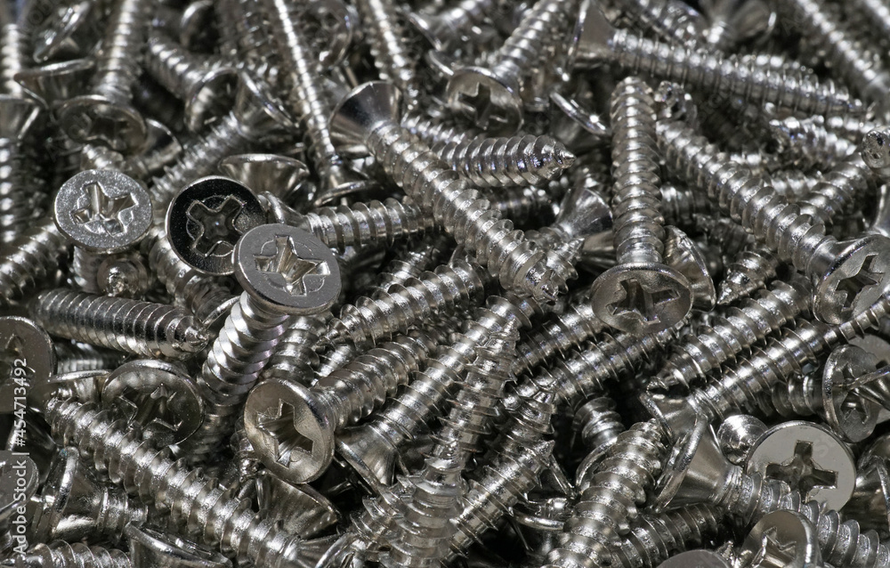A lot of metal self tapping screws, Texture background
