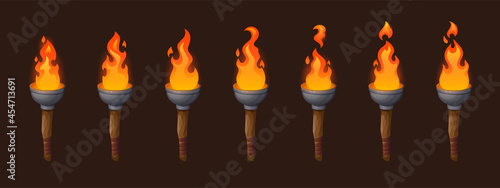 Set of medieval sprite torches with burning fire sequence animation. Ancient wooden brands with flame. Cartoon elements for pc game, flaming torchlight or lighting flambeau isolated vector icons