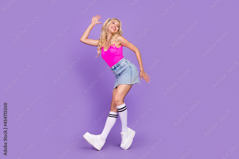 Full length body size view of charming funky cheerful girl dancing having fun isolated over vivid purple violet color background