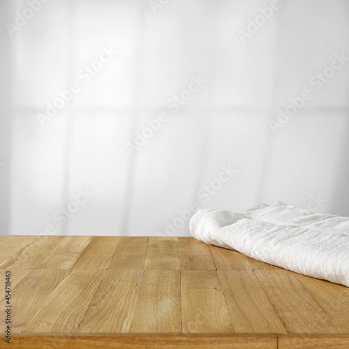 Fototapeta Naklejka Na Ścianę i Meble -  Wooden desk of free space and towels in bathroom 
