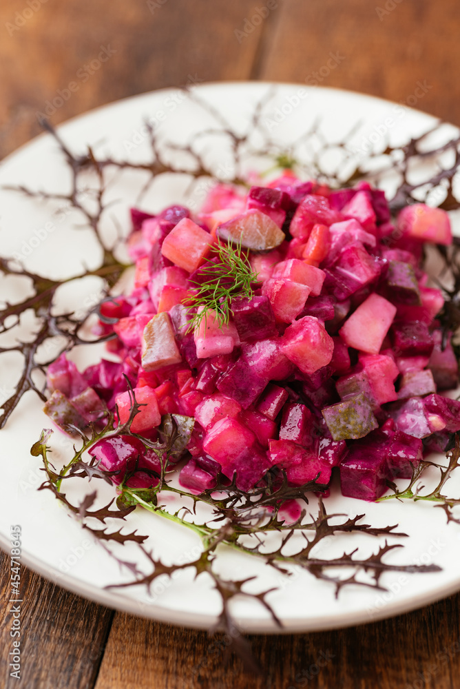 Traditional Finnish beetroot salad with potatoes, apples, carrots and pickles. Traditional Finnish beetroot salad with potatoes, apples, carrots and pickles.