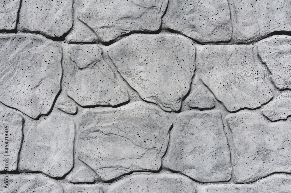 Close-up Gray concrete fence with imitation stone. Close-up Gray concrete fence with imitation stone.