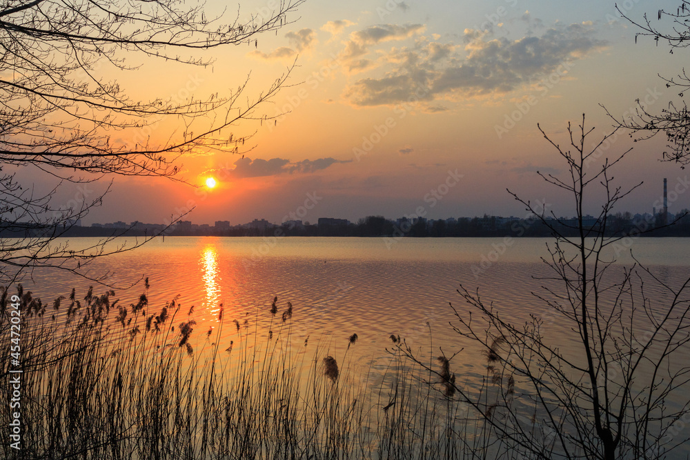 A beautiful sunset over the lake in Kyiv. Ukraine A beautiful sunset over the lake in Kyiv. Ukraine