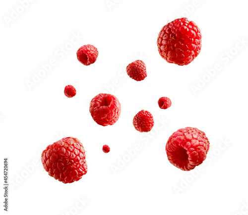 Fotografia Fresh ripe raspberries flying in the air isolated on white background