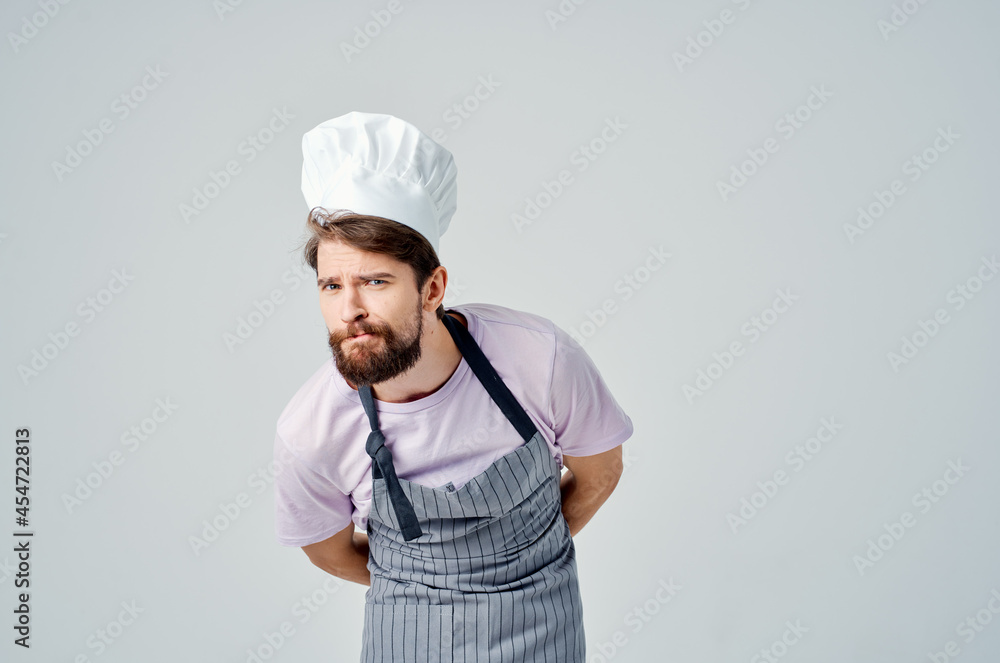 man in chef's clothes emotions professional work in a restaurant man in chef's clothes emotions professional work in a restaurant