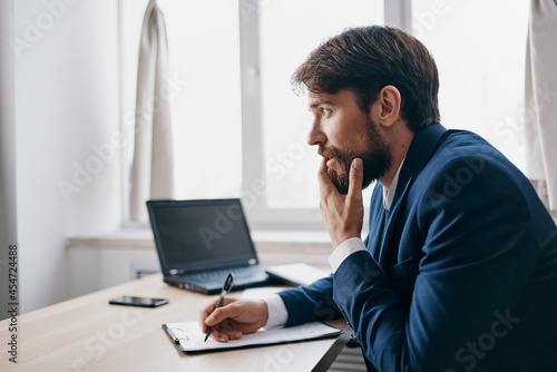 businessmen working for a laptop in the office emotions technologies