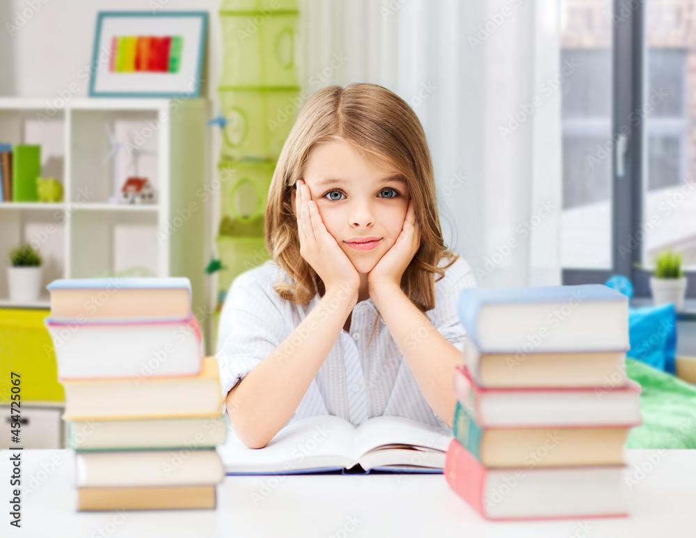 education and school concept - bored student girl reading book over home background education and school concept - bored student girl reading book over home background