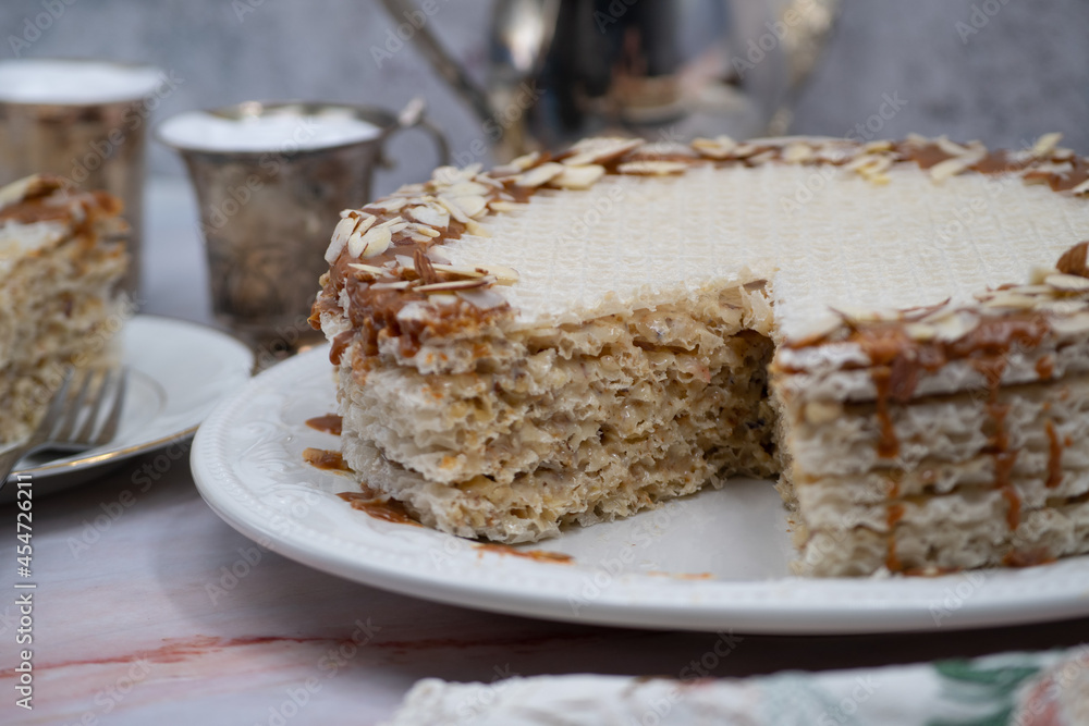 Wafer paper cake, coffee on marble table Wafer paper cake, coffee on marble table