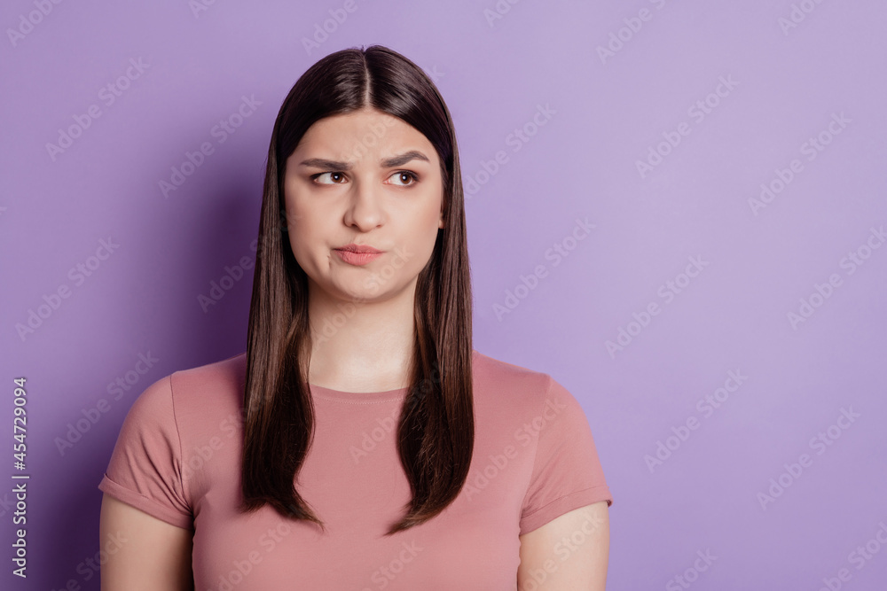 Fototapeta premium Portrait of young beautiful cute girl look empty space think thoughtful isolated on violet color background