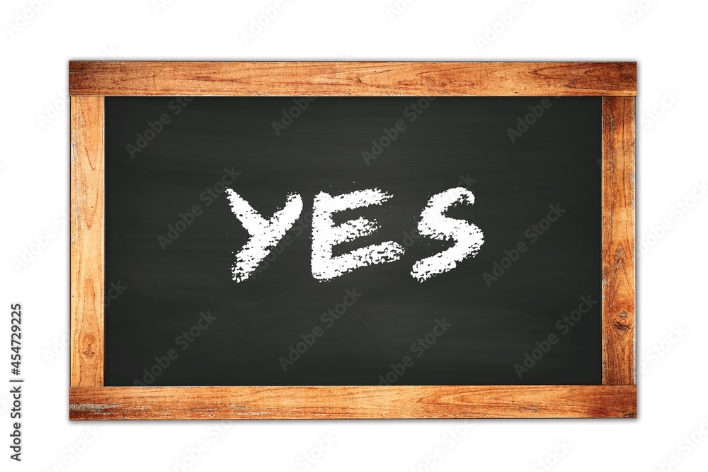 YES text written on wooden frame school blackboard. YES text written on wooden frame school blackboard.