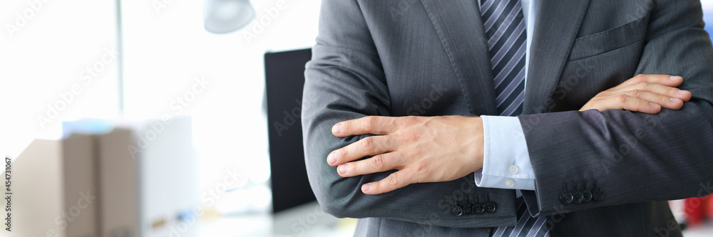 Fototapeta premium Confident businessman in gray business suit closeup