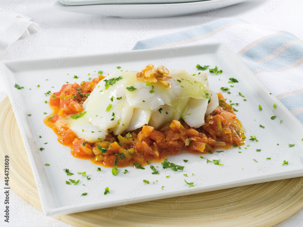 Bacalao con pisto en bandeja. Cod with ratatouille on a tray. Bacalao con pisto en bandeja. Cod with ratatouille on a tray.