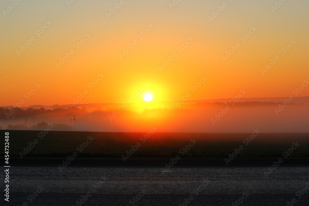 sunrise in the field and fog