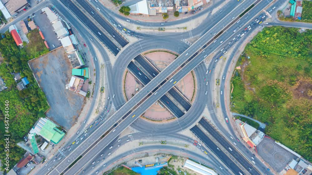 4k Time lapse of aerial view of highway junctions with roundabout. Bridge roads shape circle in structure of architecture and transportation concept. Top view. Urban city, Bangkok at sunset, Thailand. 4k Time lapse of aerial view of highway junctions with roundabout. Bridge roads shape circle in structure of architecture and transportation concept. Top view. Urban city, Bangkok at sunset, Thailand.