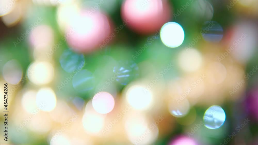 Unfocused Christmas and New Year interior decoration. Green tree decorated. Bokeh background blur Unfocused Christmas and New Year interior decoration. Green tree decorated. Bokeh background blur