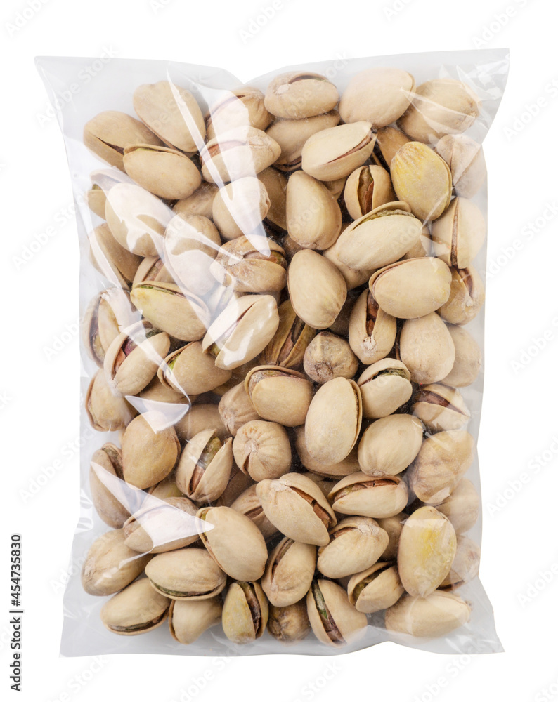 Packed pistachios on a white background. Cut out Packed pistachios on a white background. Cut out