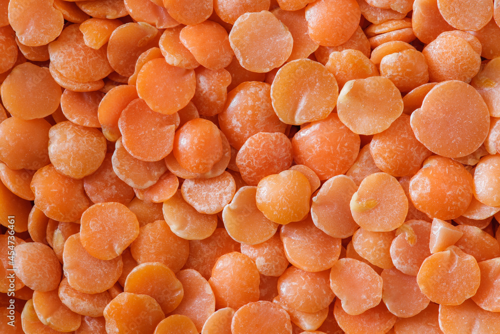 Lentil grains orange, in bulk close-up macro view, top view Lentil grains orange, in bulk close-up macro view, top view