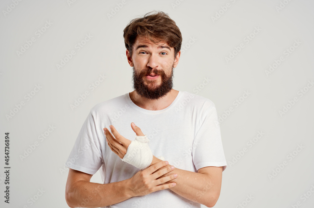 sick man bandaged hand injury to fingers hospitalization hospital medicine