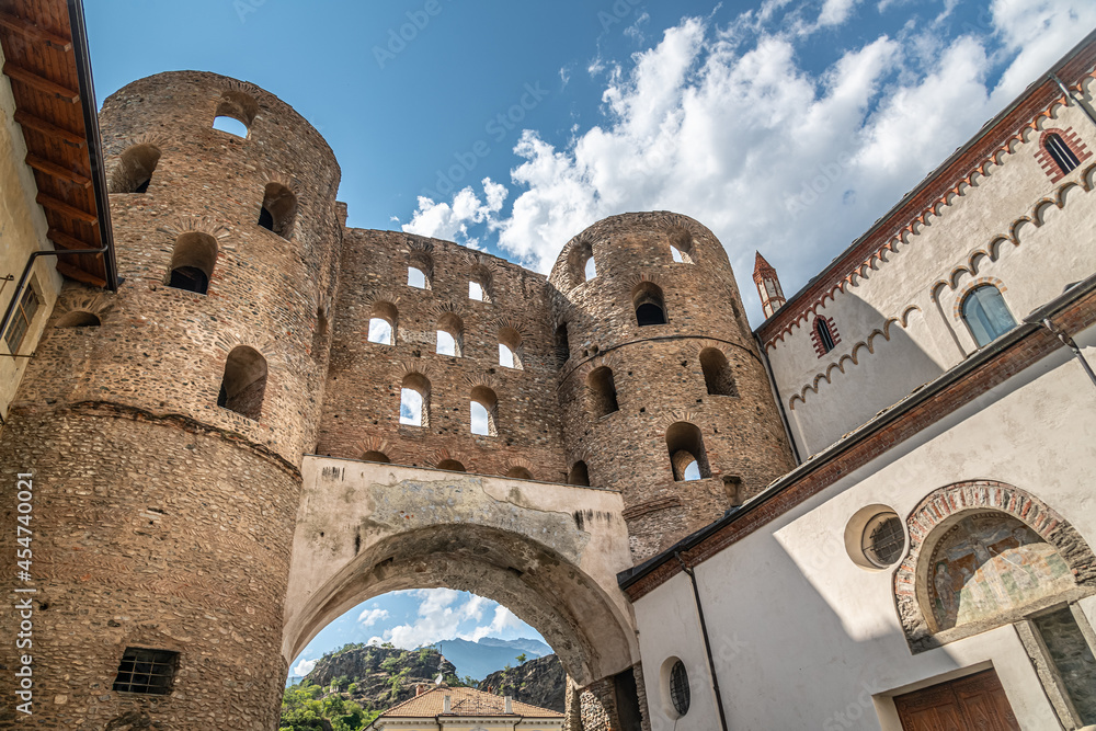 The antique roman Porta Savoia (Savoy gate) and Susa Cathedral in the Old Town of Susa, Susa Valley, Piedmont, Italy