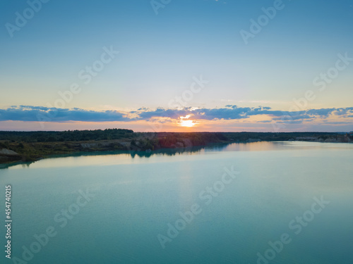 Drone view of a beautiful, amazing sunset on the chalk quarries in the summer near Krichev, Belarus