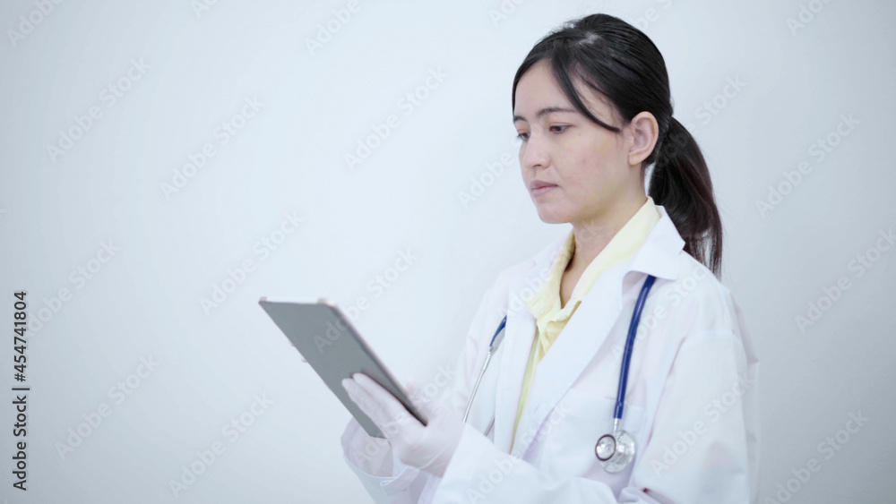Female doctor touch tablet screen searching report or disease information. Female doctor touch tablet screen searching report or disease information.