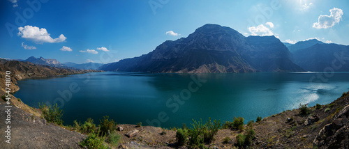 fascinating landscape of the Irganai reservoir in Dagestan with blue water and reflections of the mountains