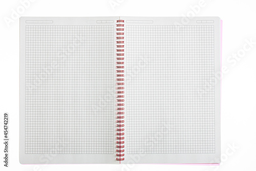 Open notebook with checkered sheets with a spring