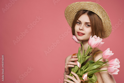 woman with bouquet of flowers attractive glamor look gift pink background