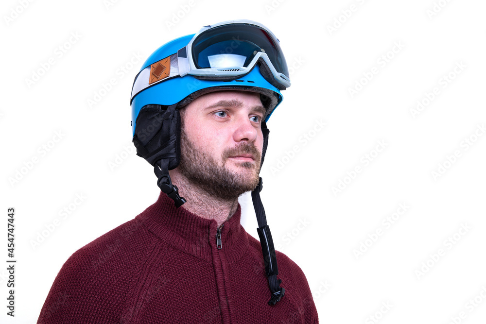 Fototapeta premium Portrait of a bearded man in a ski helmet and glasses