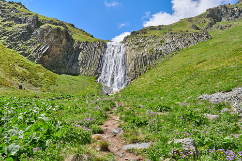 gorge high waterfall Terskol with a mountain river in the Elbrus region