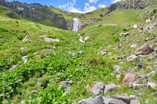 gorge high waterfall Terskol with a mountain river in the Elbrus region