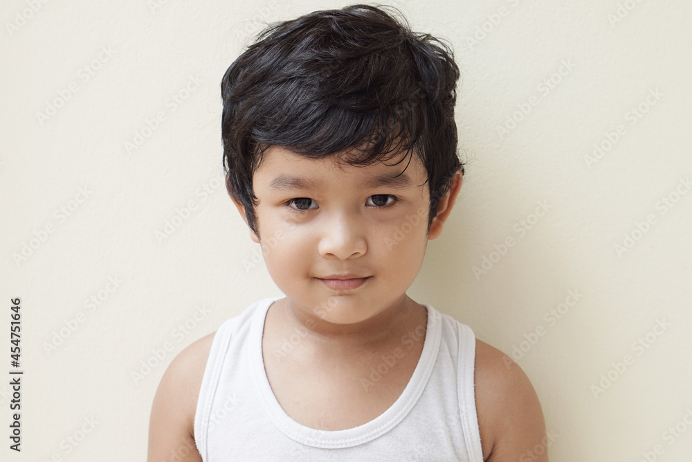 Cute Asian child little Thai boy 4 year old wearing a red sweater he have smile laugh face happy kid concept. Cute Asian child little Thai boy 4 year old wearing a red sweater he have smile laugh face happy kid concept.