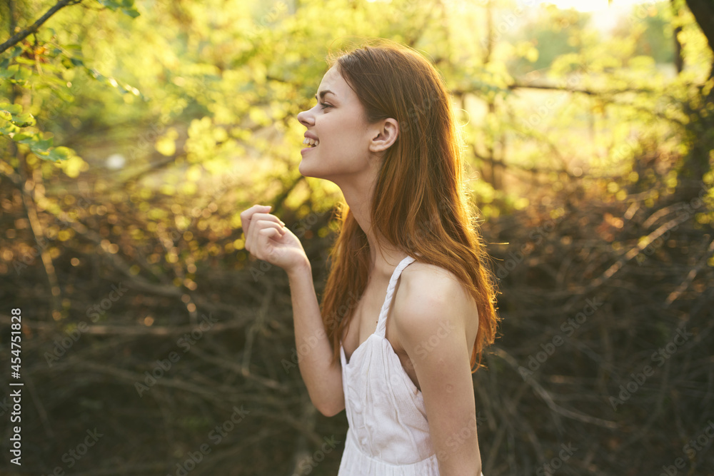 pretty woman outdoors green leaves trees summer vacation