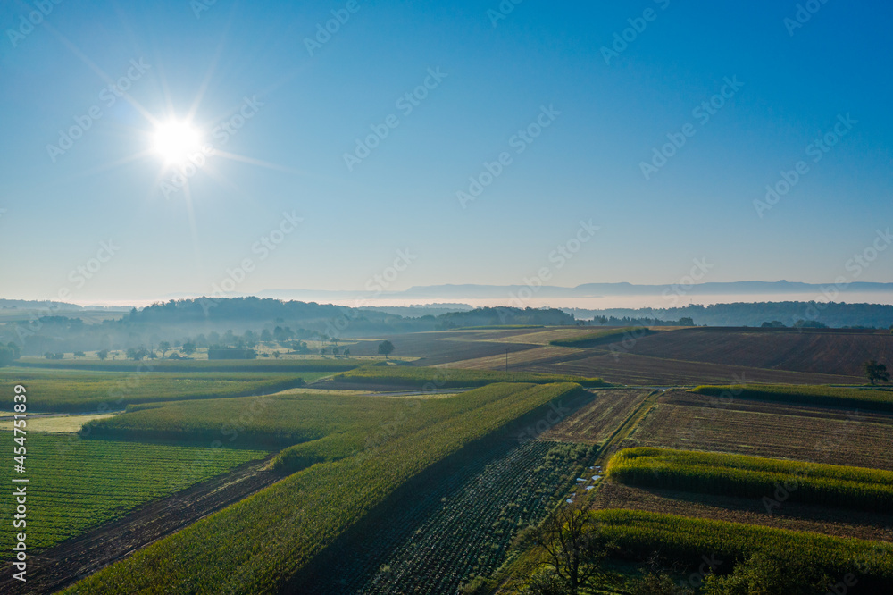 aerial view with sun and fields