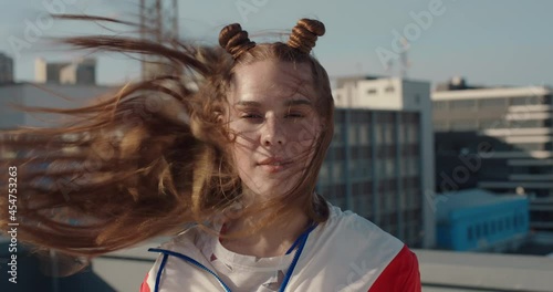 portrait red head woman with freckles looking serious with wind blowing hair teenage girl in city self image testimonial concept photo