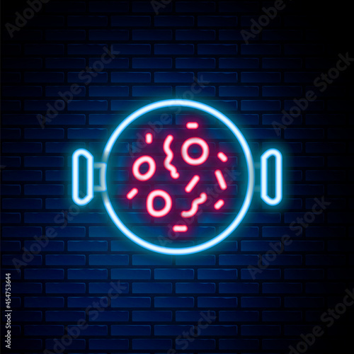 Glowing neon line Chicken tikka masala icon isolated on brick wall background. Indian traditional food. Colorful outline concept. Vector