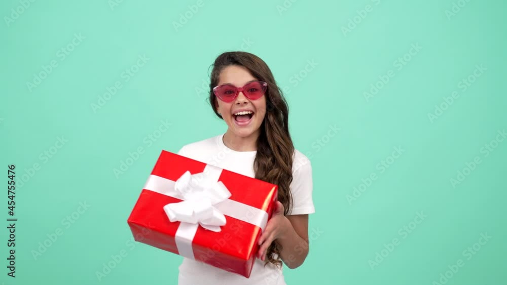 amazed child in sunglasses hold present box for birthday, happy birthday amazed child in sunglasses hold present box for birthday, happy birthday