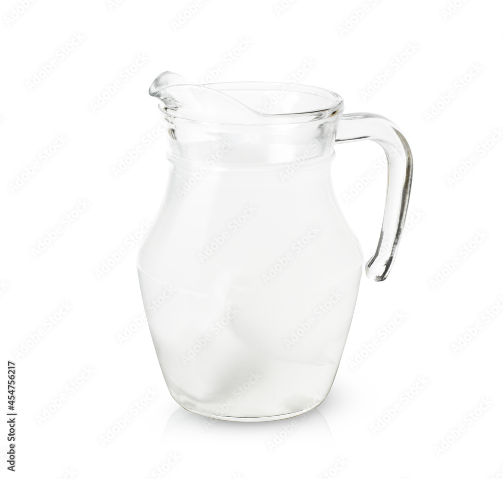 Coconut water in glass jug isolated on white Coconut water in glass jug isolated on white