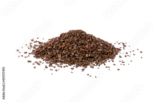 Heap of instant granules roasted coffee bean isolated on white background.