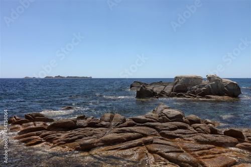 The island of Serpentara seen from the beach of Cala Pira, Sardinia, Italy photo
