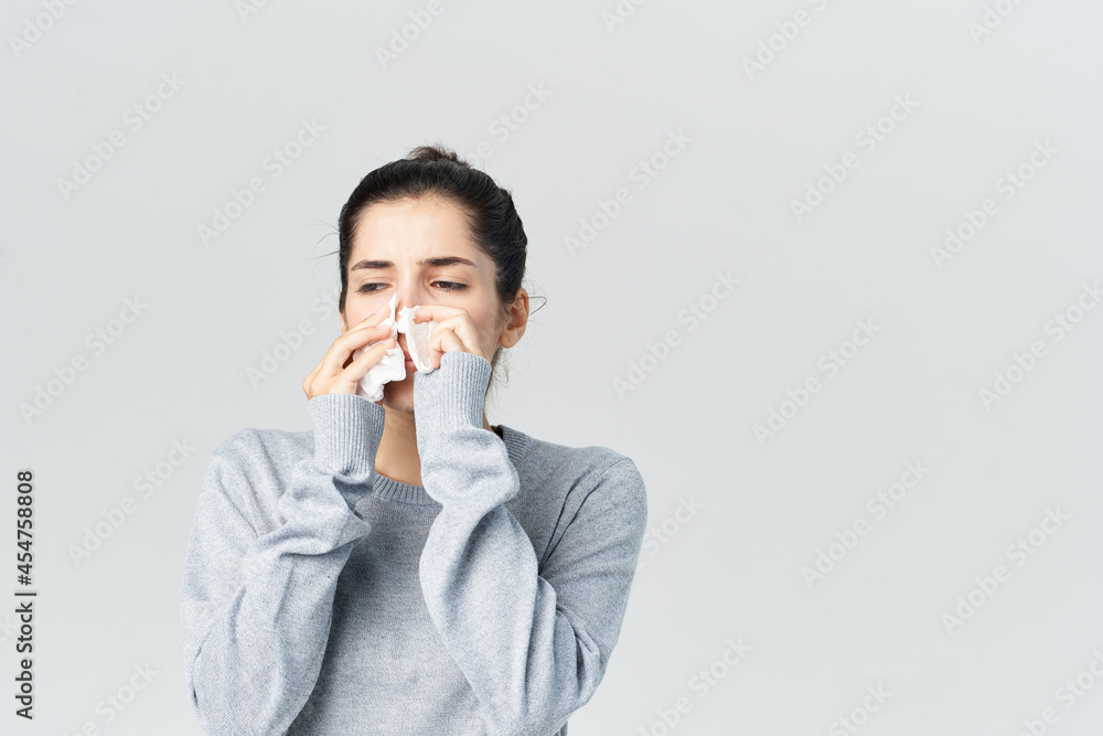 sick woman wiping face with handkerchief cold isolated background sick woman wiping face with handkerchief cold isolated background