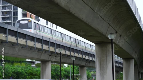 Train leaving Yishun MRT station, Singapore . Elevated rail track. photo