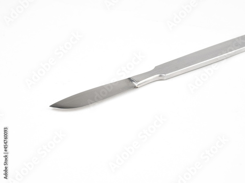 the steel medical scalpel on a white background