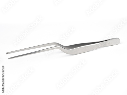 curved steel surgical tweezers with teeth on a white background