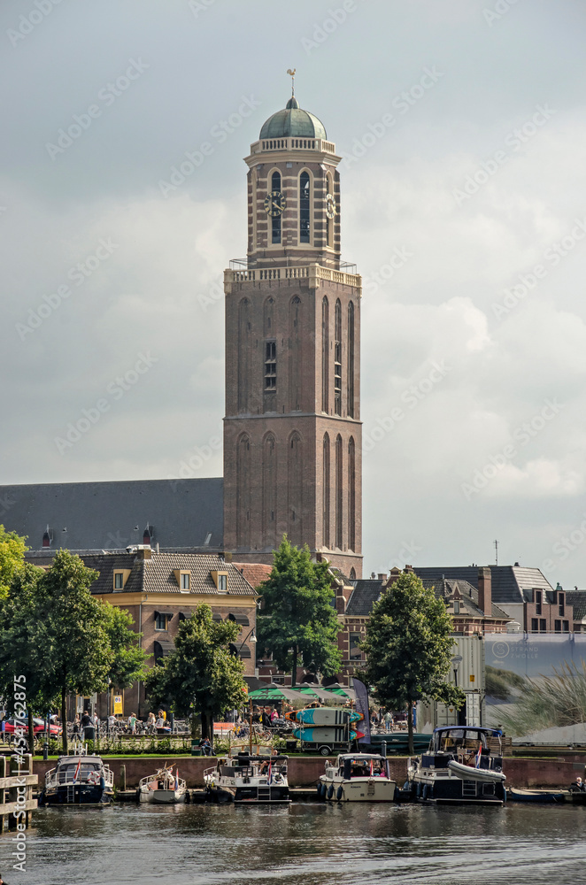 Fototapeta premium Zwolle, The Netherlands, August 20, 2021: the iconic Peperbus (Pepper can) tower rising above the houses and other buildings of the old town