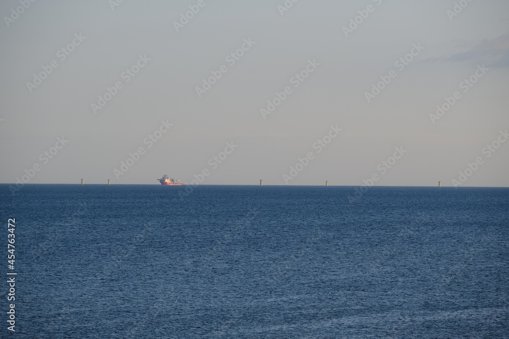 A view of a construction site offshore. An offshore wind turbines installation in the west of France not far from Saint-Nazaire. August 2021, France.